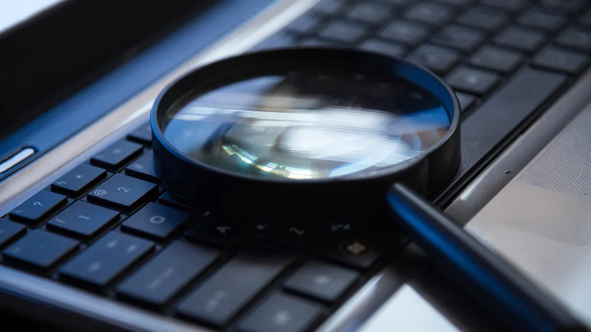 Image of a magnifier placed over a keyboard.
