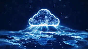 Glowing blue cloud computing icon connected to a global network, representing cloud infrastructure costs and spending.