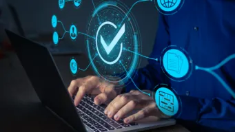 developer working at keyboard with icons floating above, illustrating how a better developer experience (devex) is the new compliance benchmark and becoming a compliance advantage.