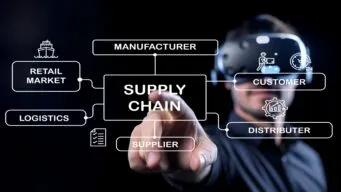 man wearing AR googles and pointing at a clear screen with supply chain diagram on it, illustrating connected supply chain orchestration