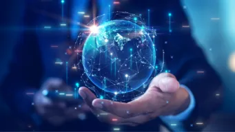 mid-shot of business man with his palm underneath an digitally enhance icon of the globe, illustrating a smart supply chain.