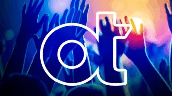 hands raised at a concert with OT logo in front