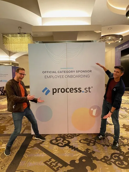 cameron mckay employee spotlight with vinay at a conference
