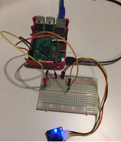 Figure 1: My Raspberry PI connected a LED and temperature sensor