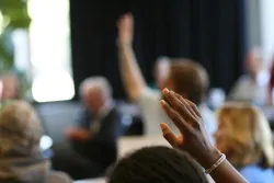 people raising their hands